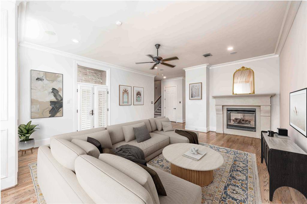 Living Room Appointed With Dual Sided Fireplace (Virtually Staged)