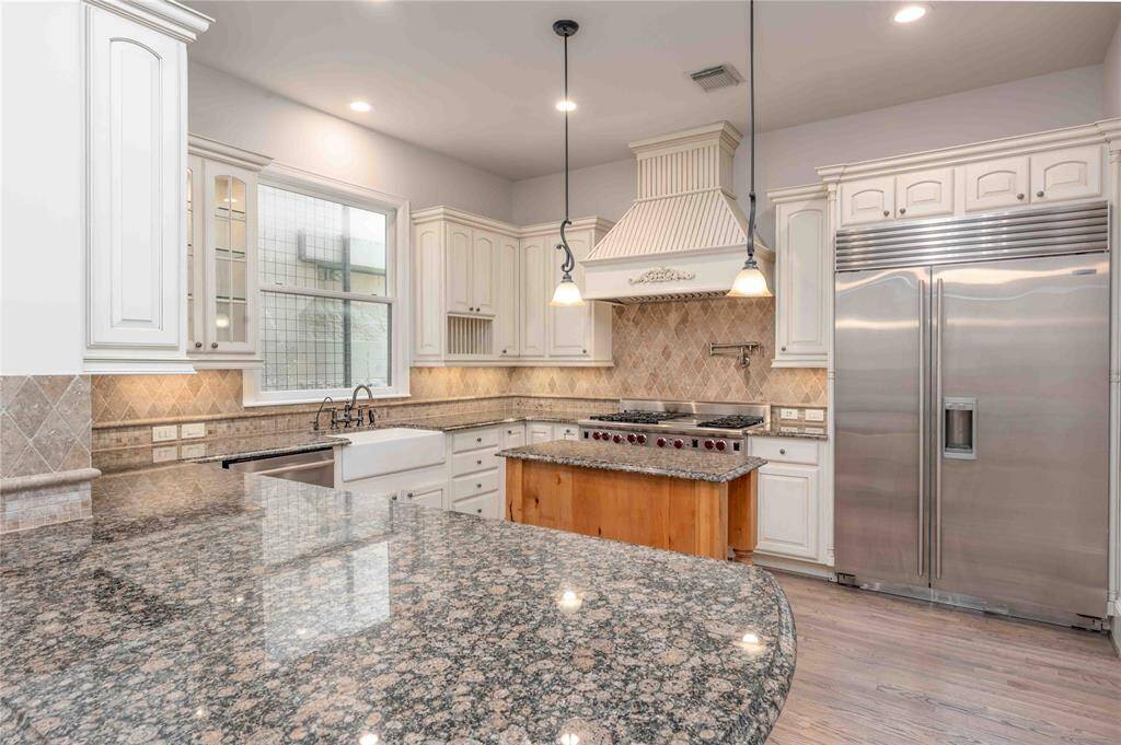 Kitchen Appointed With Custom Cabinetry & SS 48" Subzero & Wolf Appliances