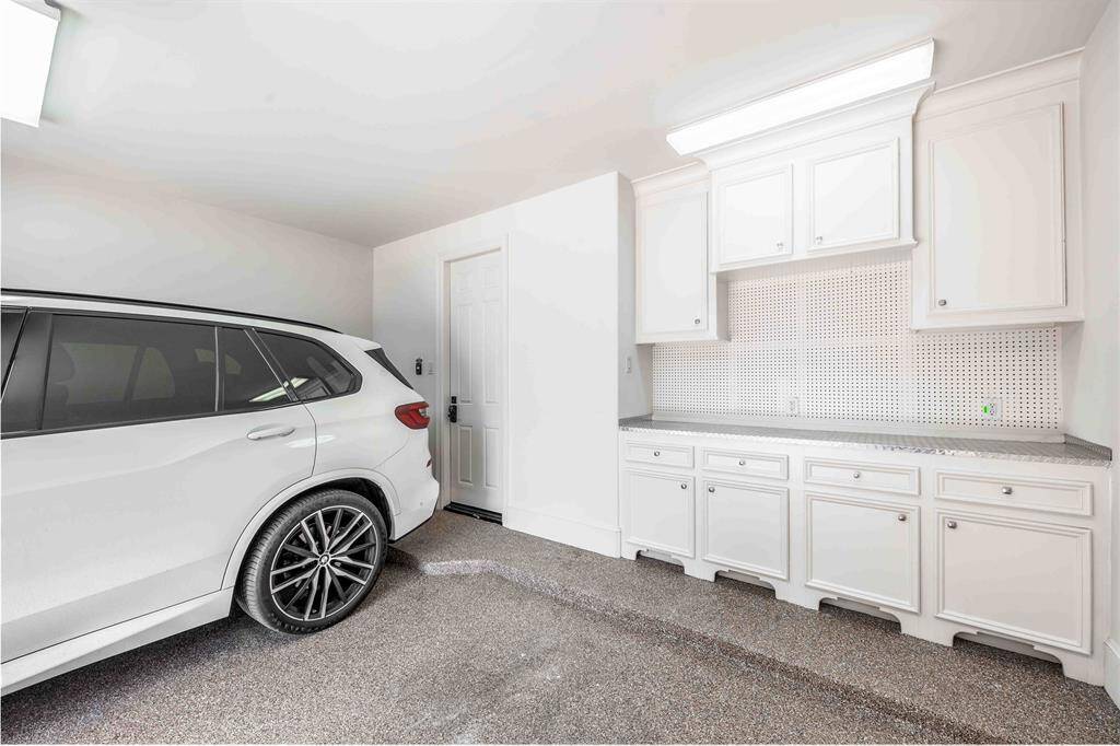 2 Car Garage With Epoxy Flooring & Custom Work Bench