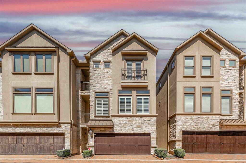 Beautiful Stone & Stucco Elevation With Cedar Garage Doors