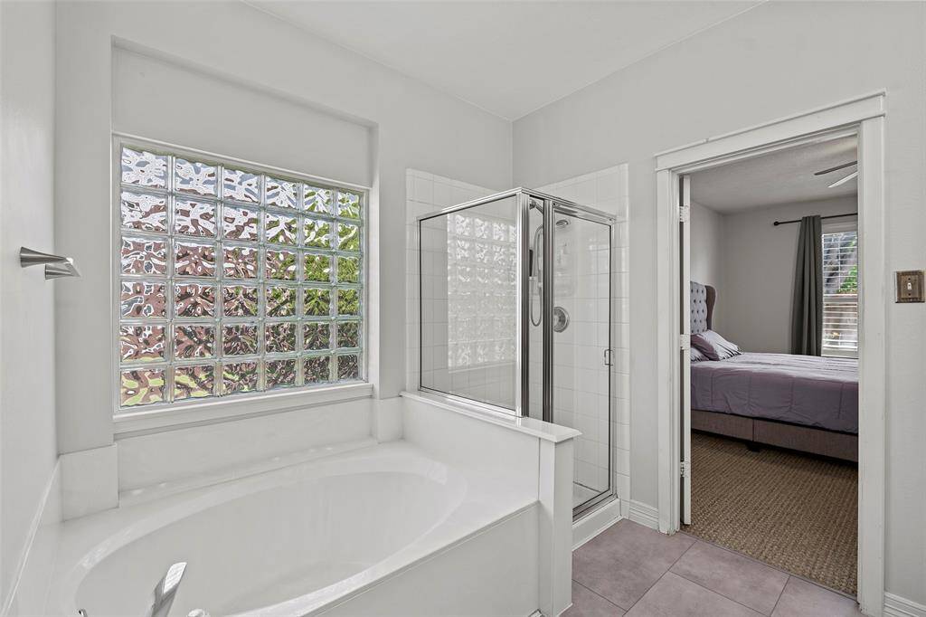 Primary En Suite with a garden tub and stand up shower.