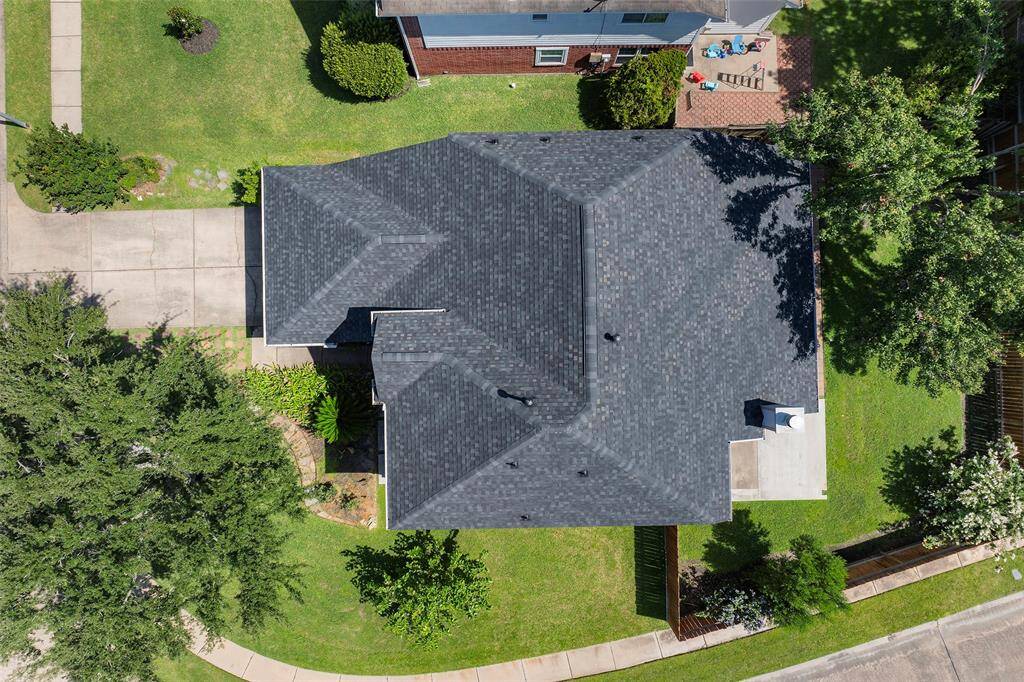 This aerial view shows the corner lot and a view of the new roof!