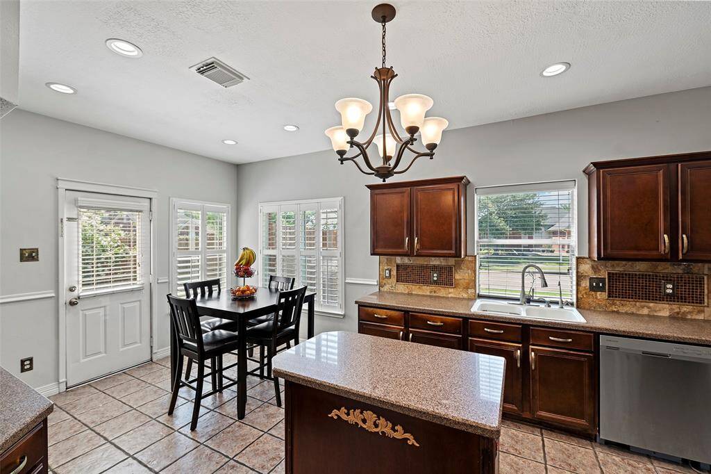 Another angle of the kitchen showing the eat in area.