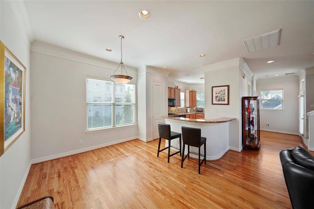 Another view of the dining area and kitchen.