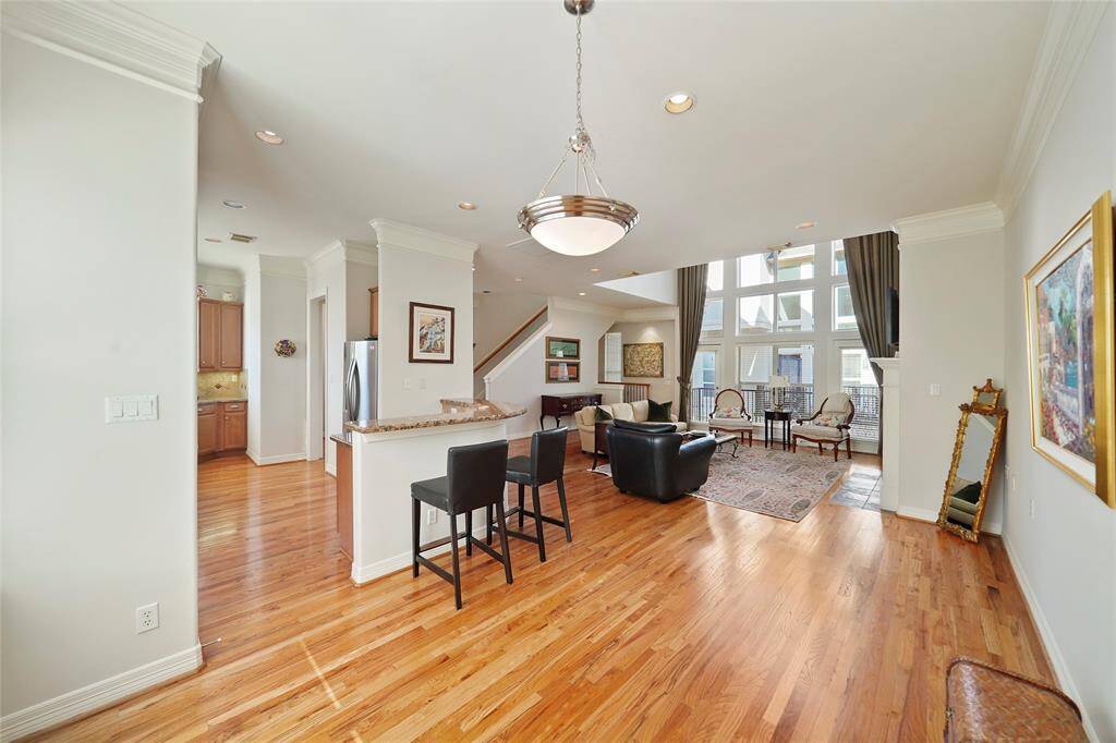 A view of the living area from the dining area showing the open floor plan.
