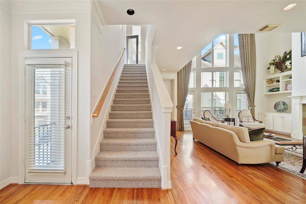 The door leading to the south balcony and the stairs to the master bedroom.