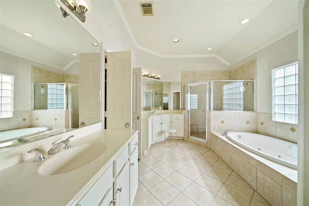 The master bathroom has double sinks, a whirlpool tub and separate shower and the bathroom was recently painted.