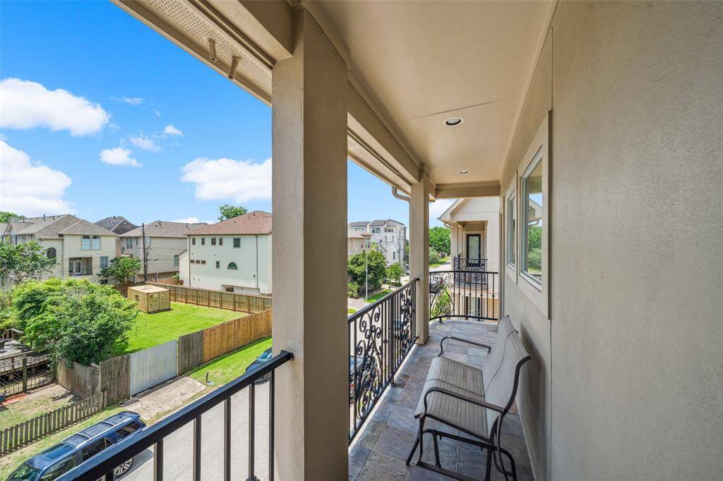 The third floor balcony providing great views of the neighborhood and a fabulous spot to relax and kick back.