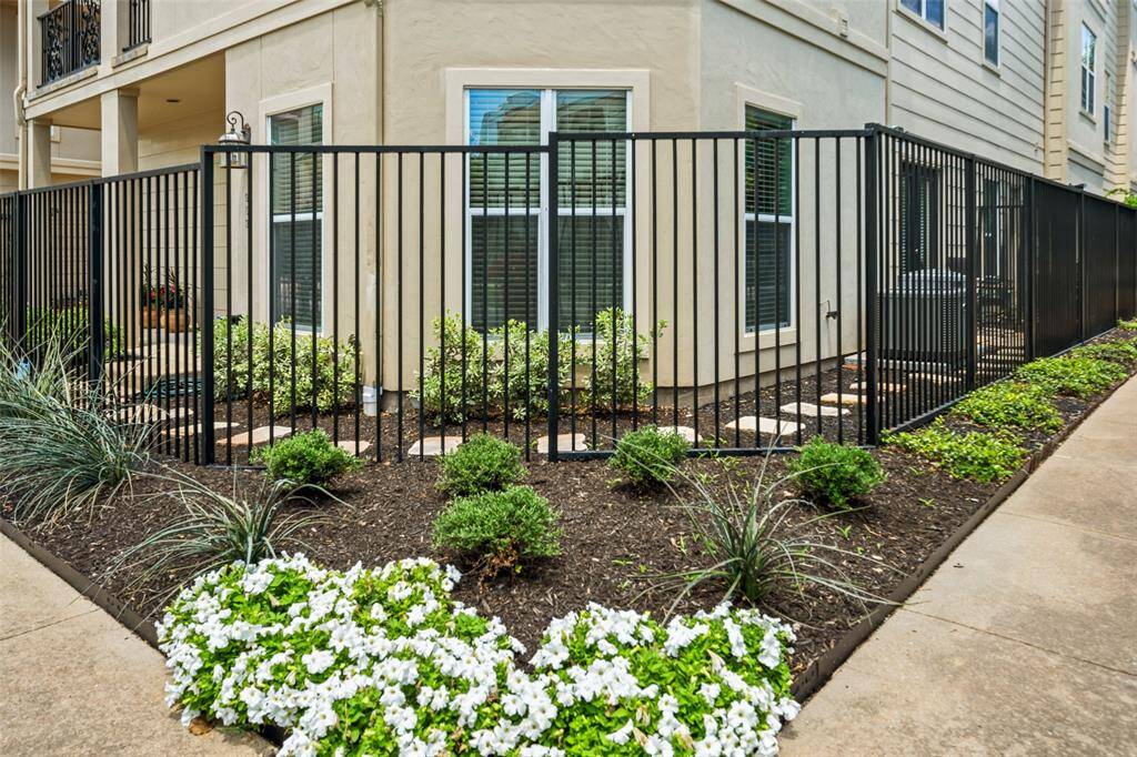 The home features beautiful landscaping throughout.