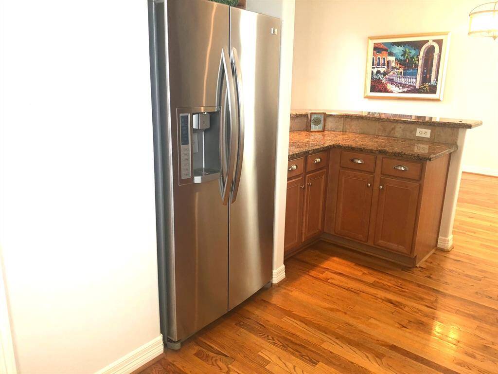 The stainless steel Refrigerator will be staying.