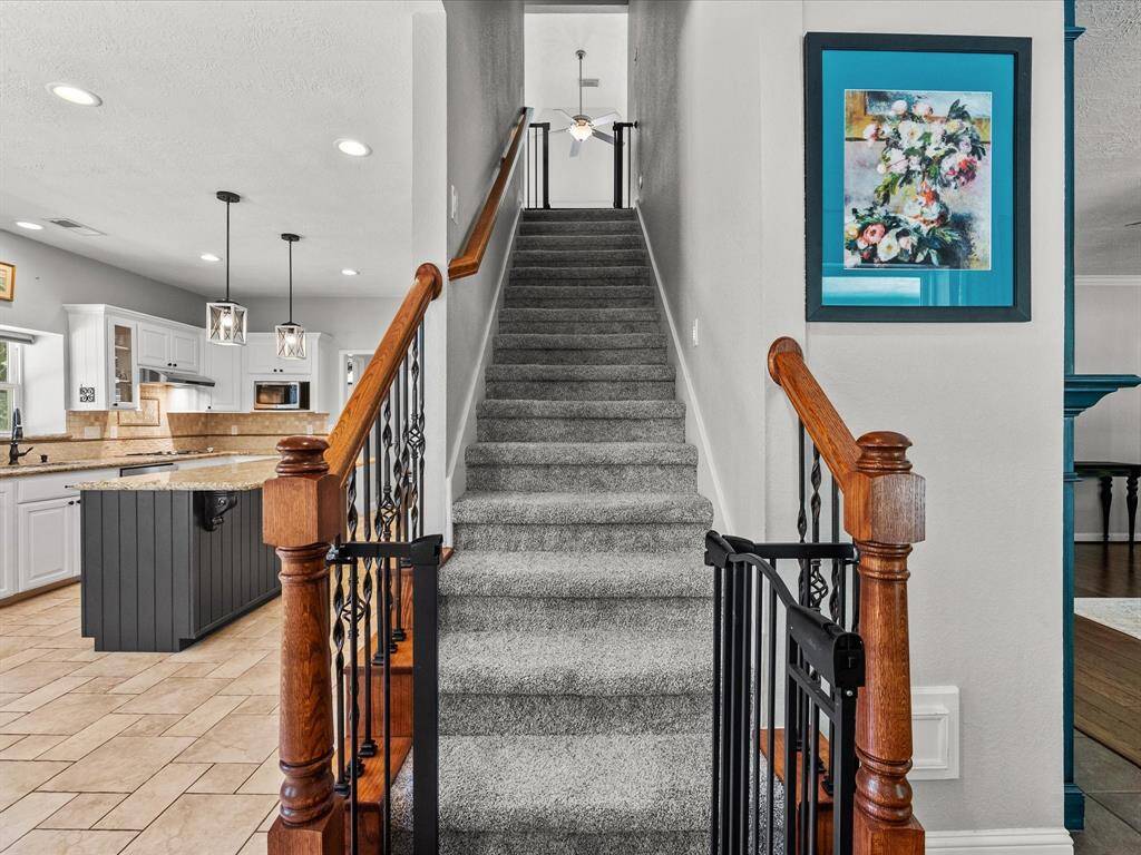 This photo showcases a welcoming entry leading to the upper floor.