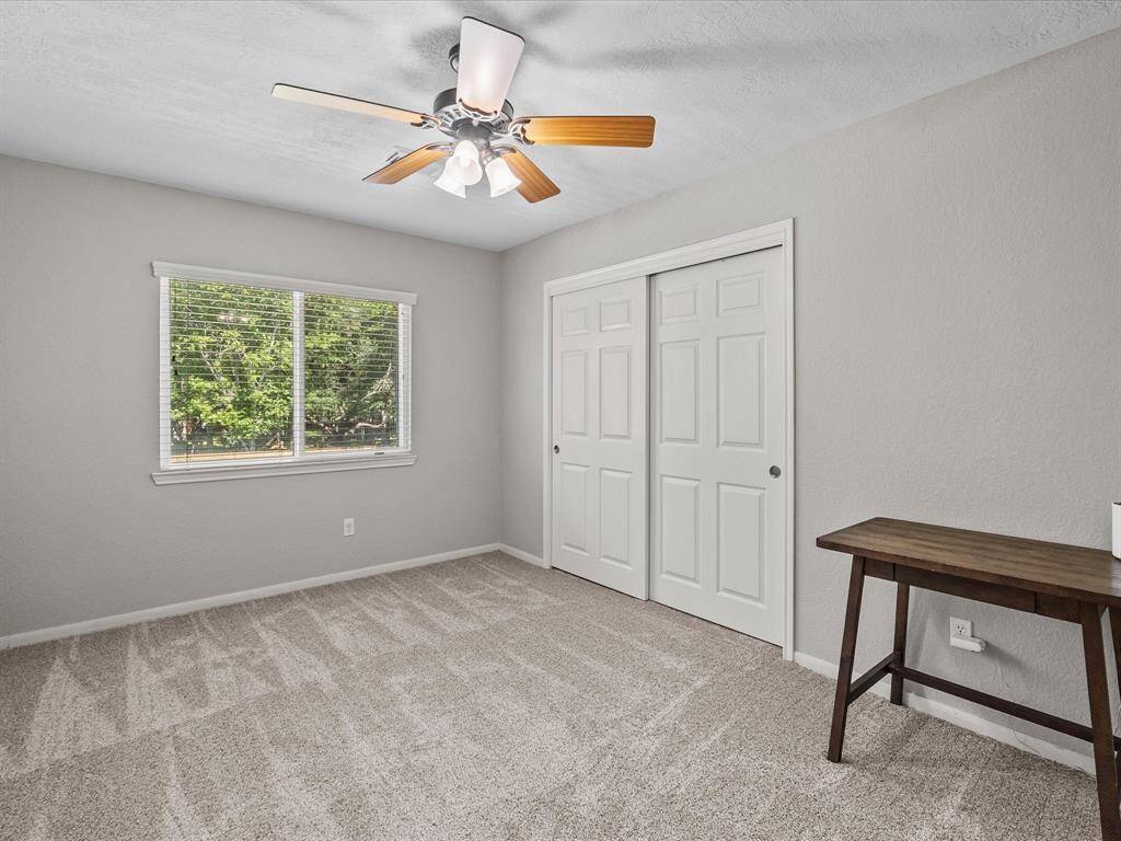 This bedroom faces the backyard and has a large closet and plenty of light.