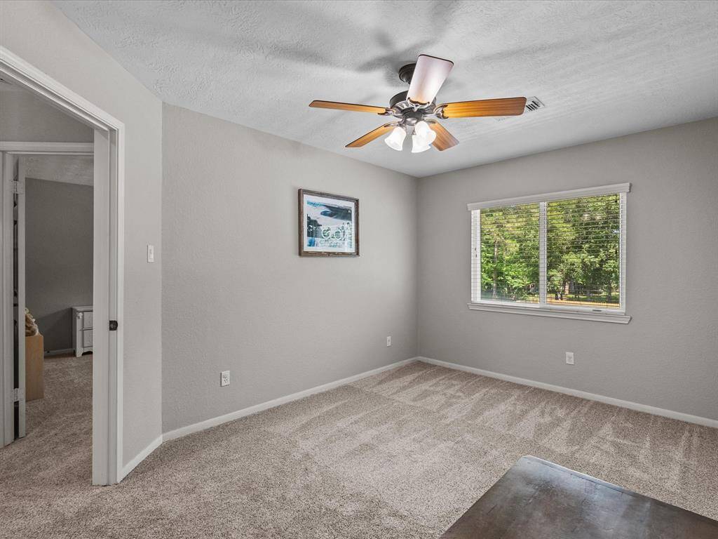 This bedroom faces the backyard and has a large closet and plenty of light.