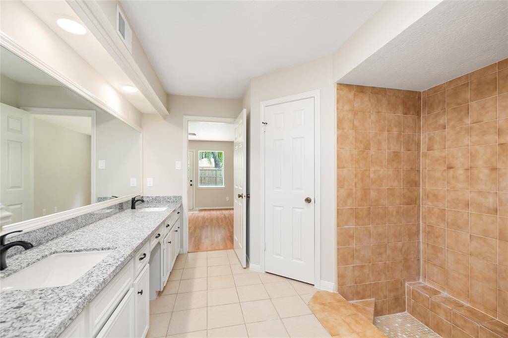 Imagine retreating to this spacious primary suite, where every corner is designed for comfort and relaxation. Whether you’re unwinding after a long day or enjoying a quiet morning, this room offers the perfect balance of privacy and openness. With its direct access to the backyard, en-suite bathroom, and generous walk-in closet, it’s an inviting sanctuary that complements your lifestyle.