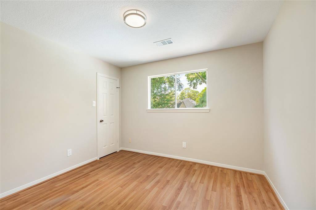 This inviting secondary bedroom offers a flexible space perfect for a bedroom, home office, or guest room. With plenty of natural light and a layout that suits a variety of needs, it’s a cozy and functional addition to the home.