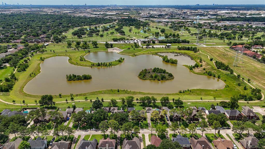 This beautiful view of the nearby pond enhances the serene atmosphere of the community. Its tranquil waters and surrounding greenery create a peaceful setting, offering a perfect spot for relaxation and enjoying nature right outside your door.
