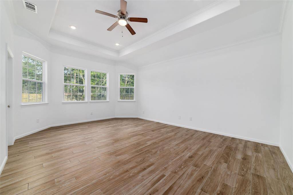 Huge primary retreat featuring tray ceiling.