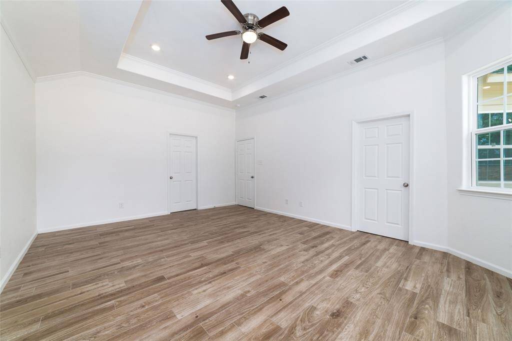 Primary suite includes TWO walk-in closets.