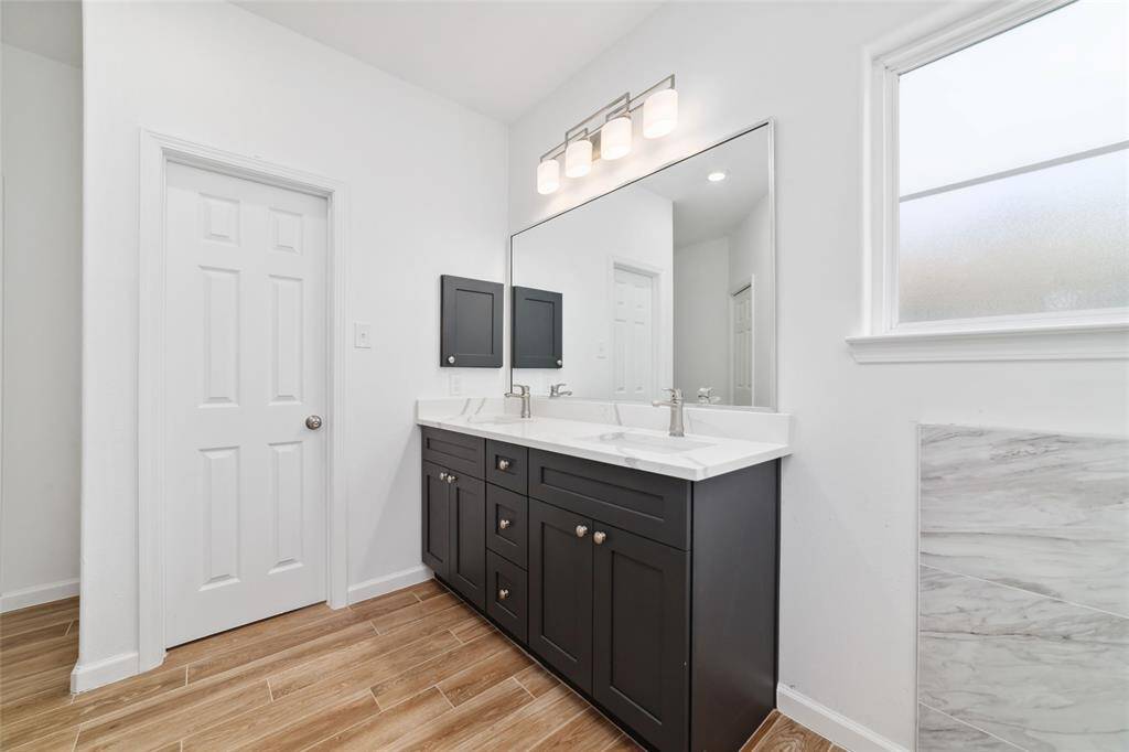 No fighting over the sink or counter space in this bathroom!