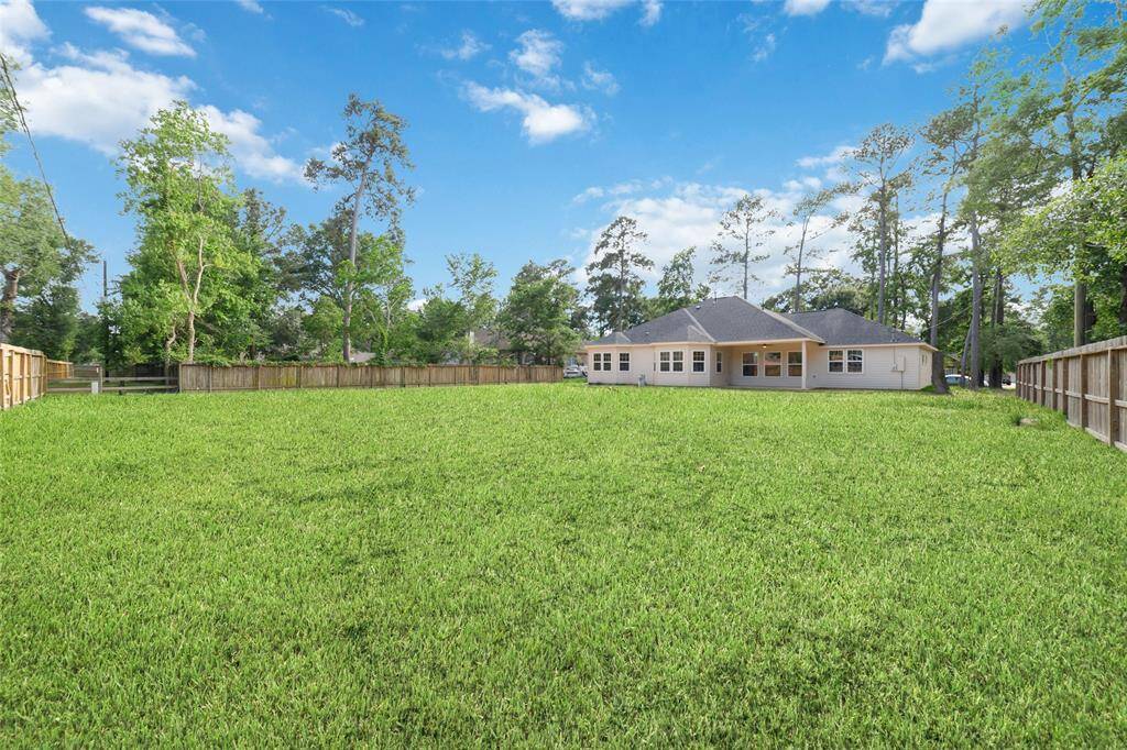 Huge backyard with plenty of space for a pool. This is representative of what it will look like with grass. Currently it is dirt as construction has just been completed.