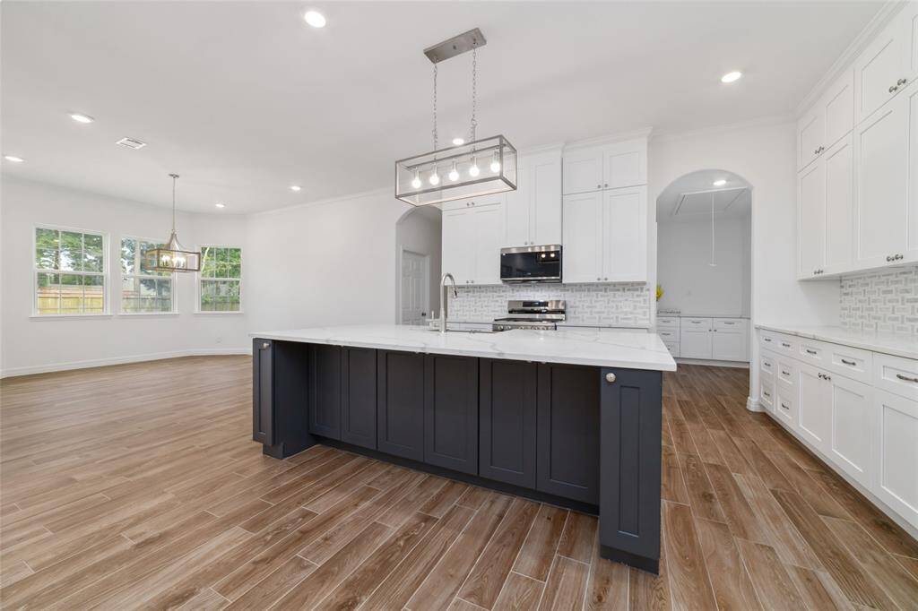 Thoughtfully designed with lots of cabinet space under the island.