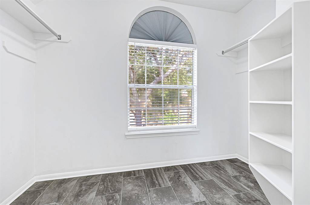 Two walk-in closets in primary bedroom