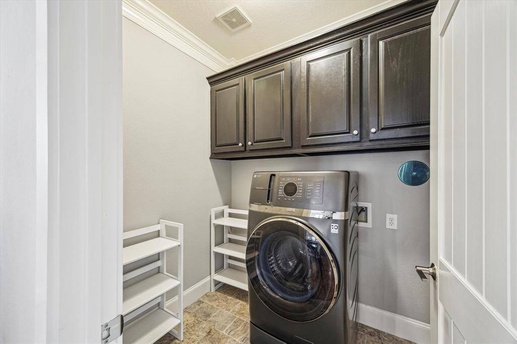 Utility room located in the house, washer / dryer combo comes with the house