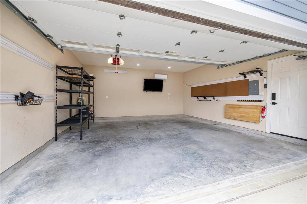 Garage comes with a Mitsubishi air conditioner and TV