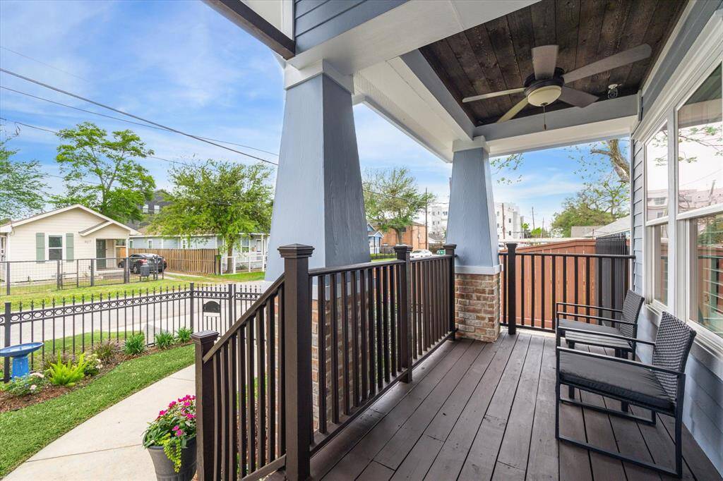 Spacious front porch with a fan, perfect for sipping your morning coffee
