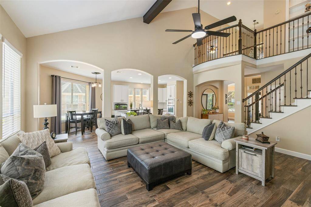 Room is spacious with high ceilings and opens to the kitchen and breakfast area.