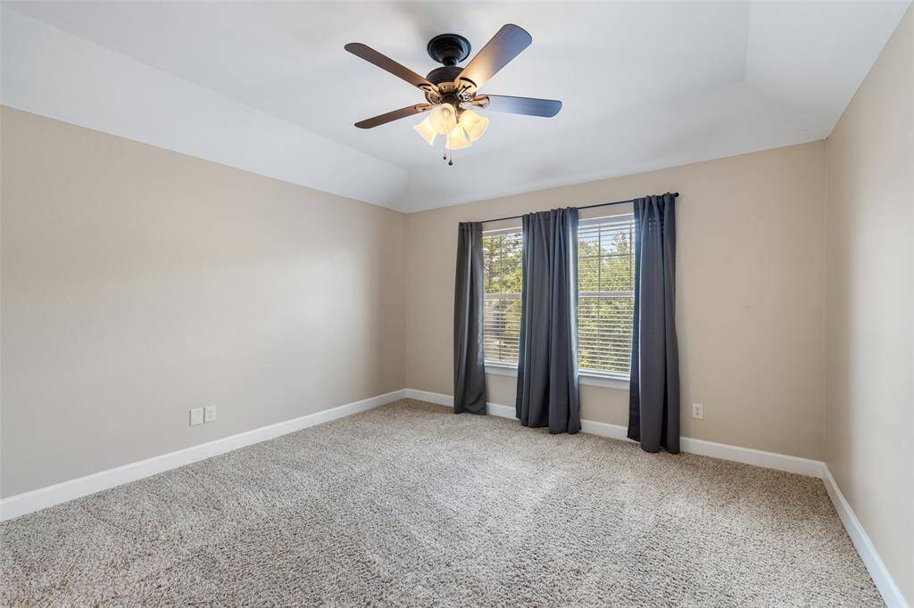 Bedroom #3 has large windows and overlooks the front yard.