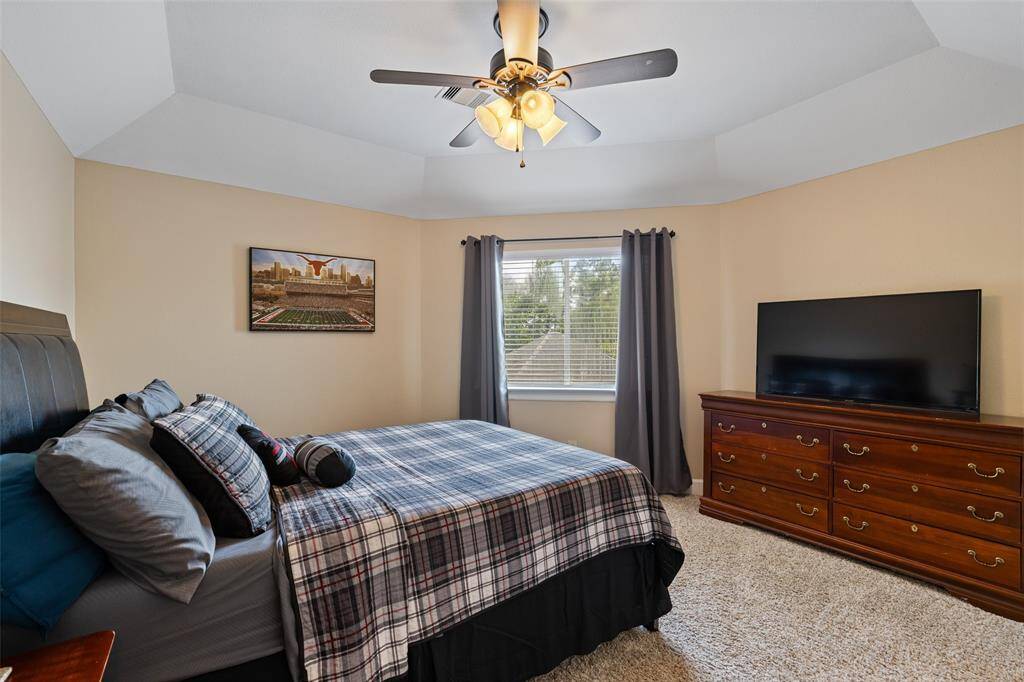 Bedroom #4 is spacious and positioned at the back of the home.