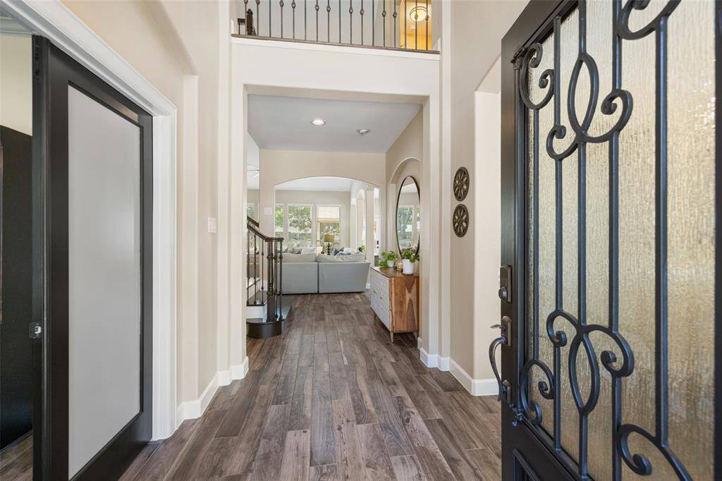 Entry features high ceilings and windows to bring in tons of natural light.