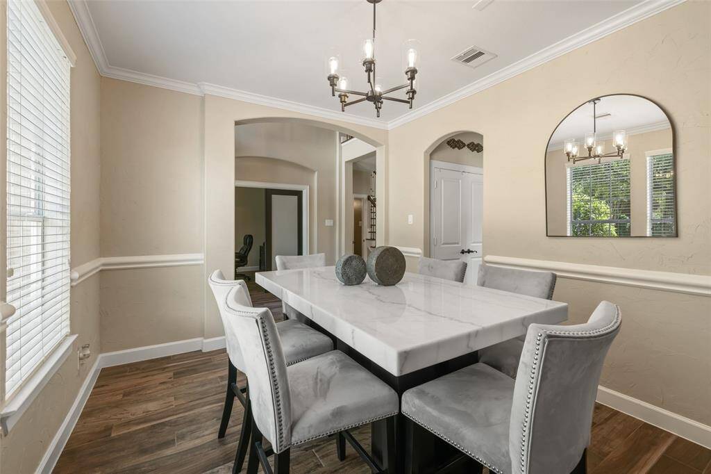 The dining room is perfect for entertaining guests and has easy access to the pantry and kitchen. Plenty of room for oversized furniture.