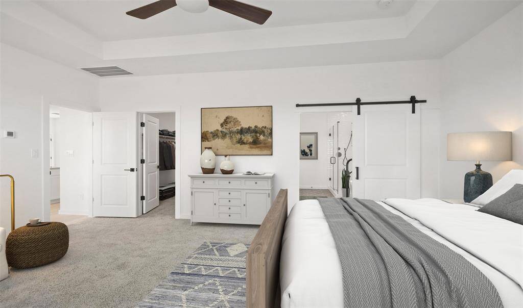 Secluded primary suite with ceiling treatment (*Photo not of actual home and used for illustration purposes only.)