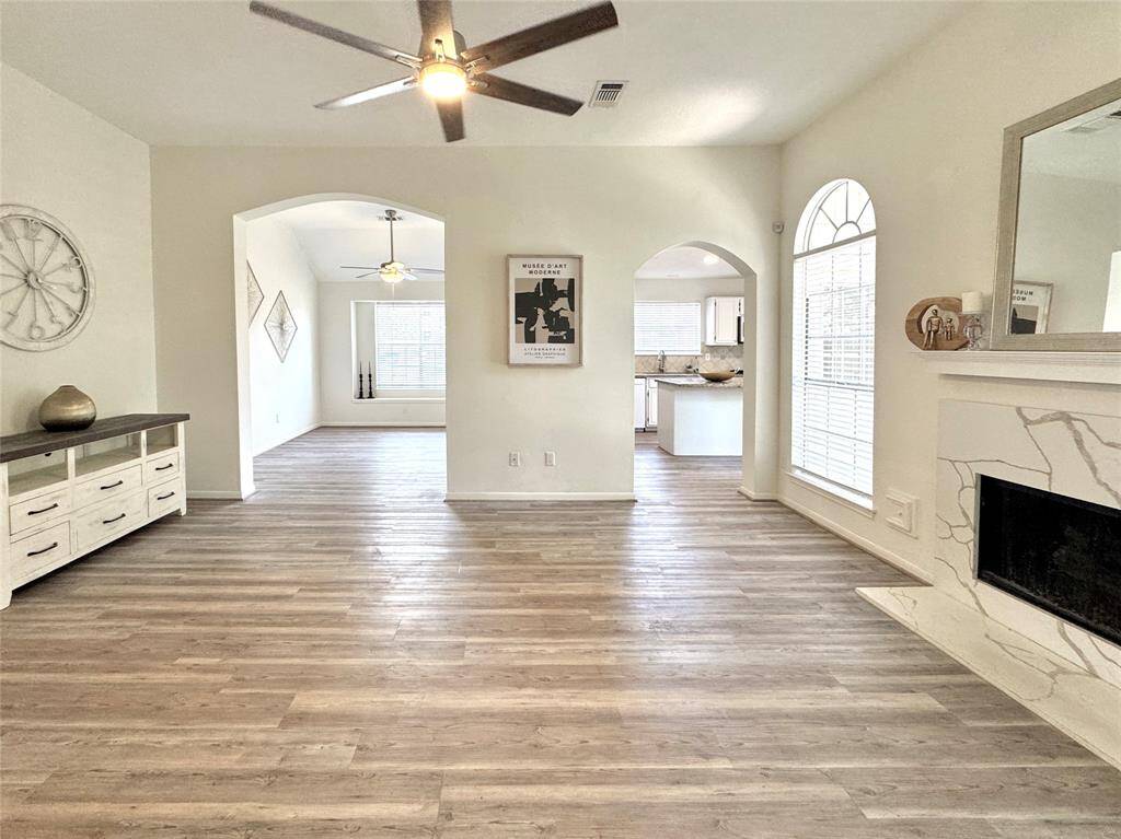 View from Family Room of arched doorways leading into the Dining Room and Kitchen