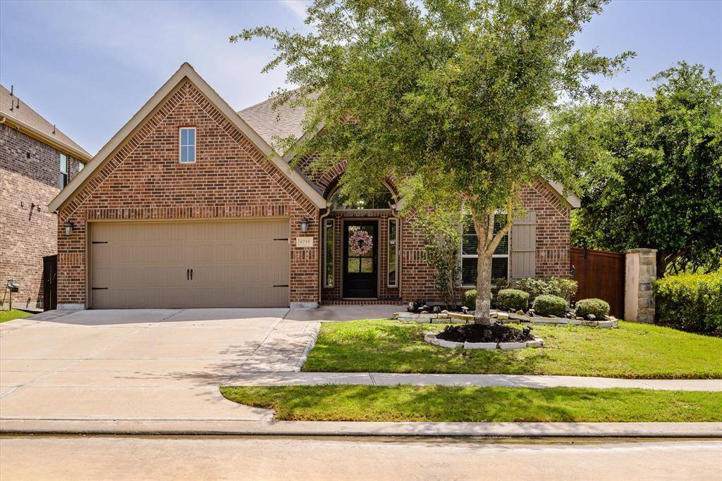Charming single-story home with elegant brick exterior.