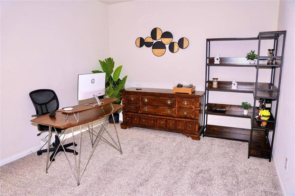 Game room converted into a traditional office space