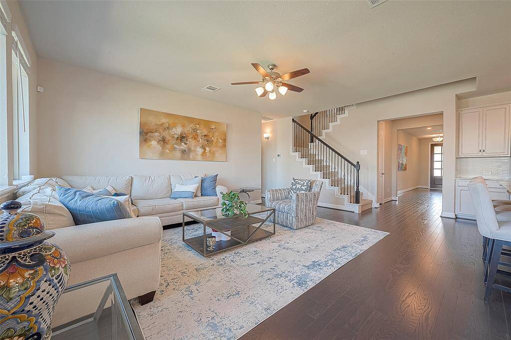 With its tasteful decor and inviting ambiance, the view of the living room sets the tone for the rest of the home, promising warmth, comfort, and a sense of arrival.