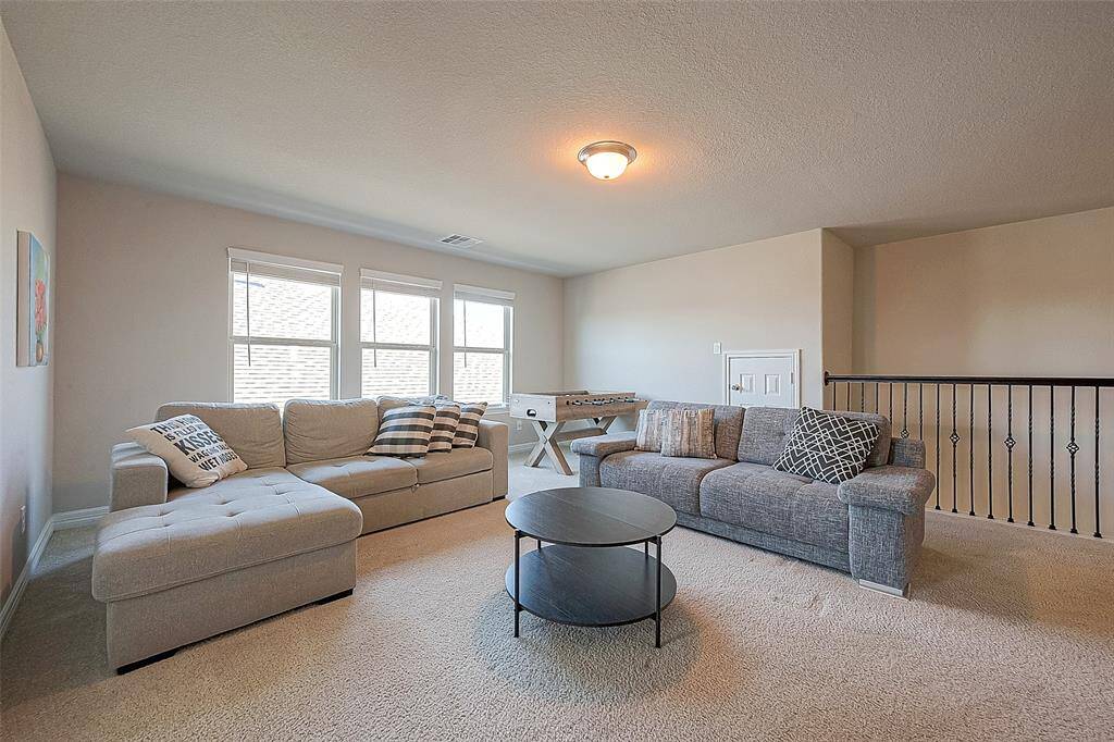 As you step on the second floor, you'll find this ample game room, it is not just a luxury, it's a lifestyle enhancement that adds value and versatility to the home.