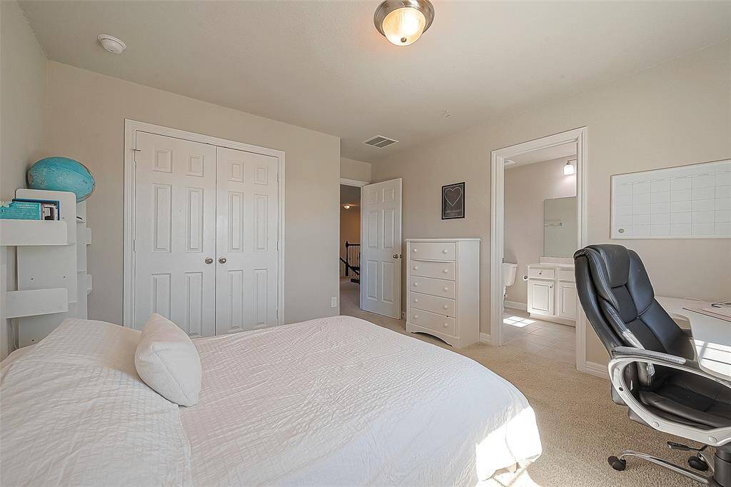 Natural light floods through the windows, creating a bright and airy atmosphere, and this room has its own en-suite bathroom for privacy.