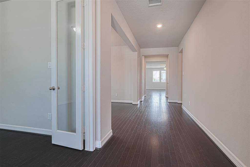 Your eyes are drawn to the elegant foyer as you enter, bathed in natural light streaming through the windows. To your left you'll find the office and the formal dining.