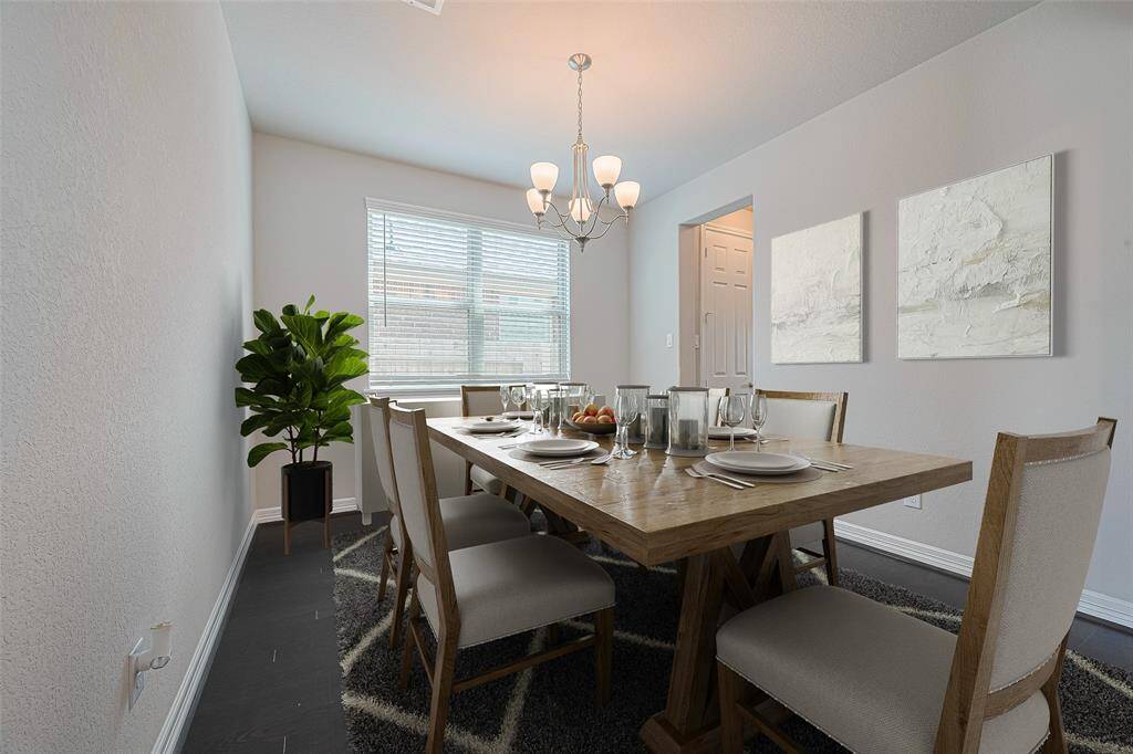Step into elegance with the formal dining area, a refined space designed for hosting sophisticated gatherings and memorable meals. (virtually staged)