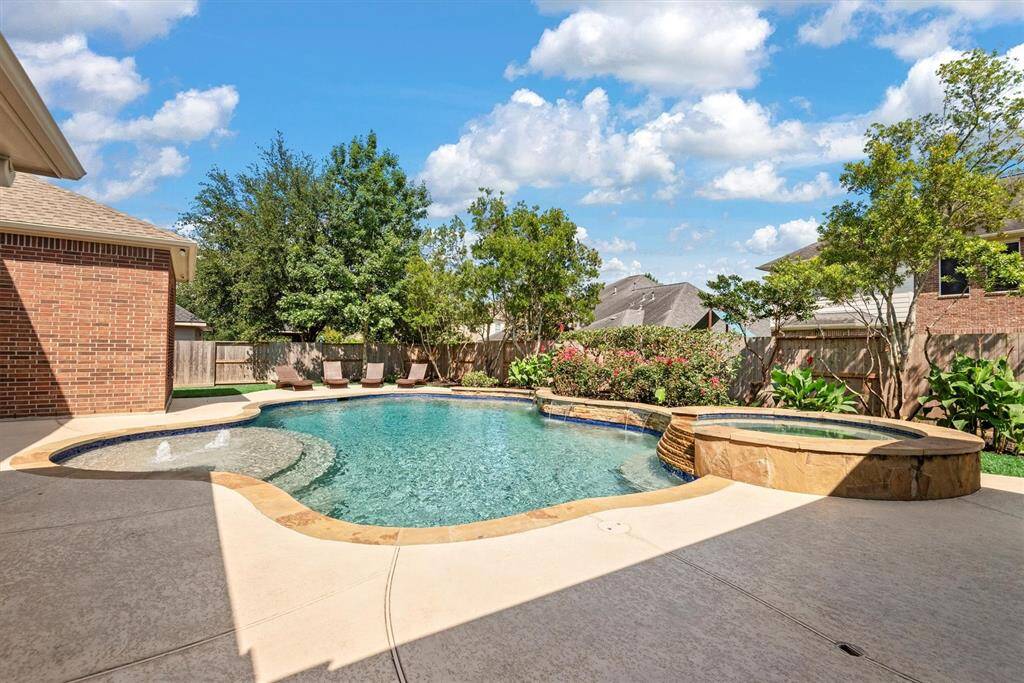 Imagine yourself relaxing by this stunning pool, making unforgettable memories with friends and family.