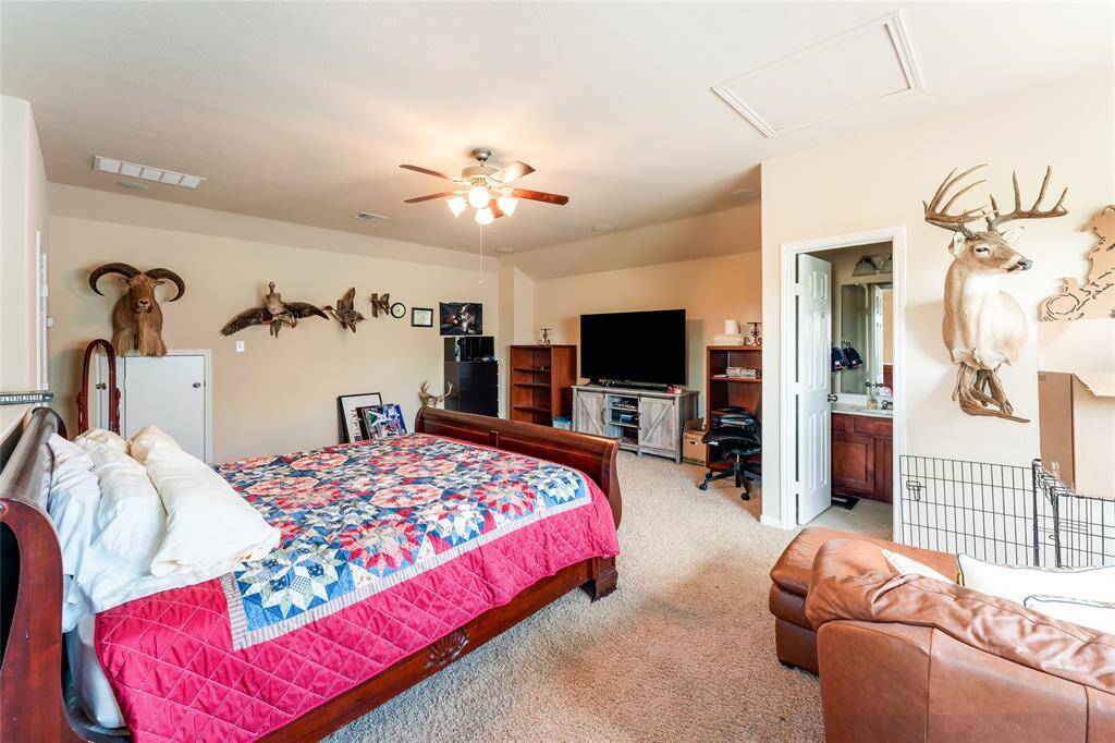 Spacious upstairs game room or flex space, featuring a full bath, closet, and plenty of natural light from multiple windows, with recessed lighting and a ceiling fan for added comfort.