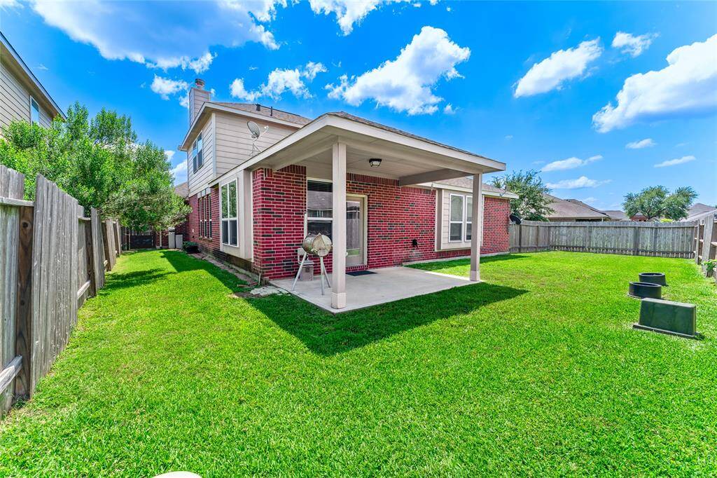 Large corner-lot backyard with a covered patio, perfect for entertaining, relaxing, gardening, or whatever you imagine!