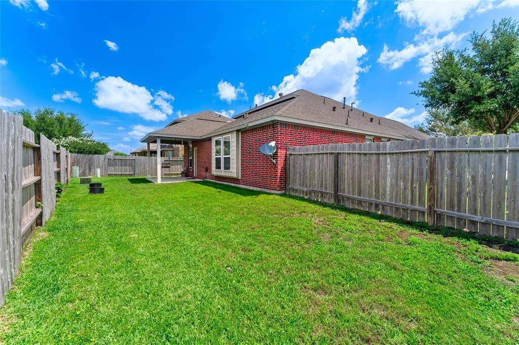 Large corner-lot backyard with a covered patio, perfect for entertaining, relaxing, gardening, or whatever you imagine!