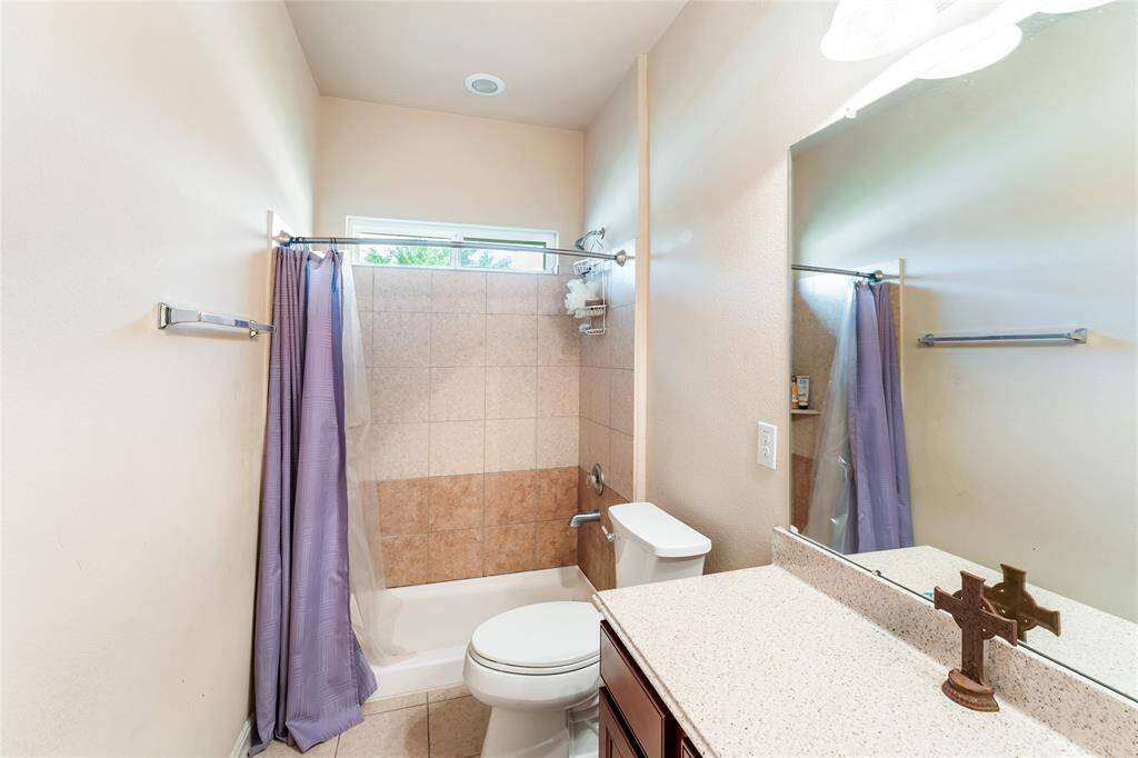 First full bath conveniently located off the entry hallway, near two spacious bedrooms.