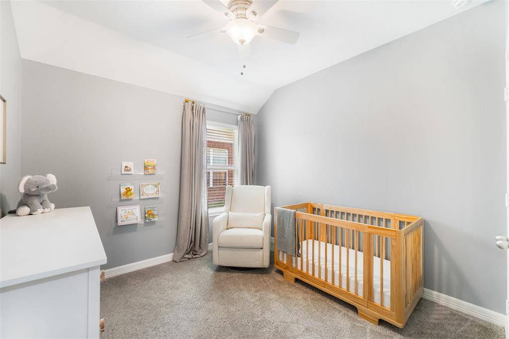The second of two secondary bedrooms is being used here as a sweet nursery. The neutral paint color makes this a good room for any age.