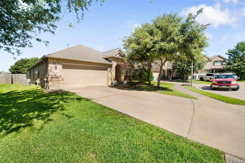 The home is inviting, thanks to a double-wide driveway for extra parking, a shaded entryway, and mature landscaping. Bryant Elementary is within walking distance!